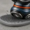 Why Rotary Shavers Cause Less Irritation: the Physics of the Lift-and-Cut Cycle